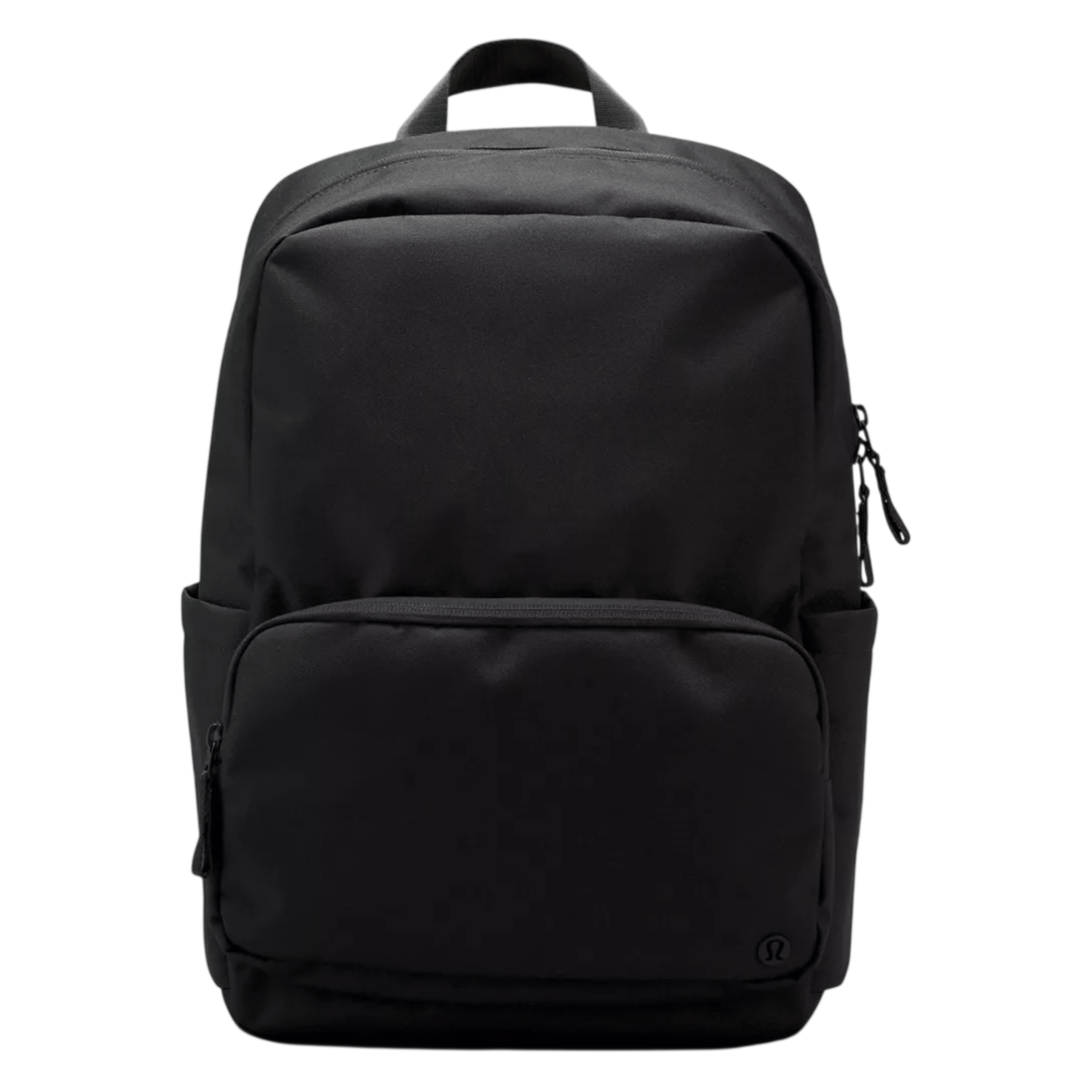 A sleek black backpack with a minimalist design, featuring a large main compartment, a front zippered pocket, and a top handle for easy carrying.