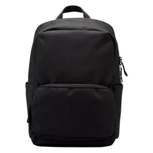 A sleek black backpack with a minimalist design, featuring a large main compartment, a front zippered pocket, and a top handle for easy carrying.