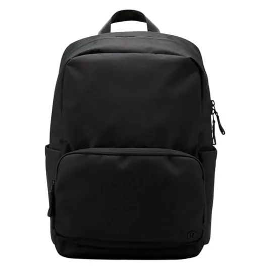 A sleek black backpack with a minimalist design, featuring a large main compartment, a front zippered pocket, and a top handle for easy carrying.