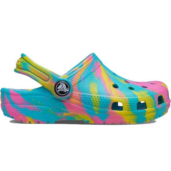 Crocs Kids' Tie-Dye Clogs feature a vibrant swirl of blue, pink, and yellow hues. They are equipped with a strap for a secure fit and ventilation ports for breathability.
