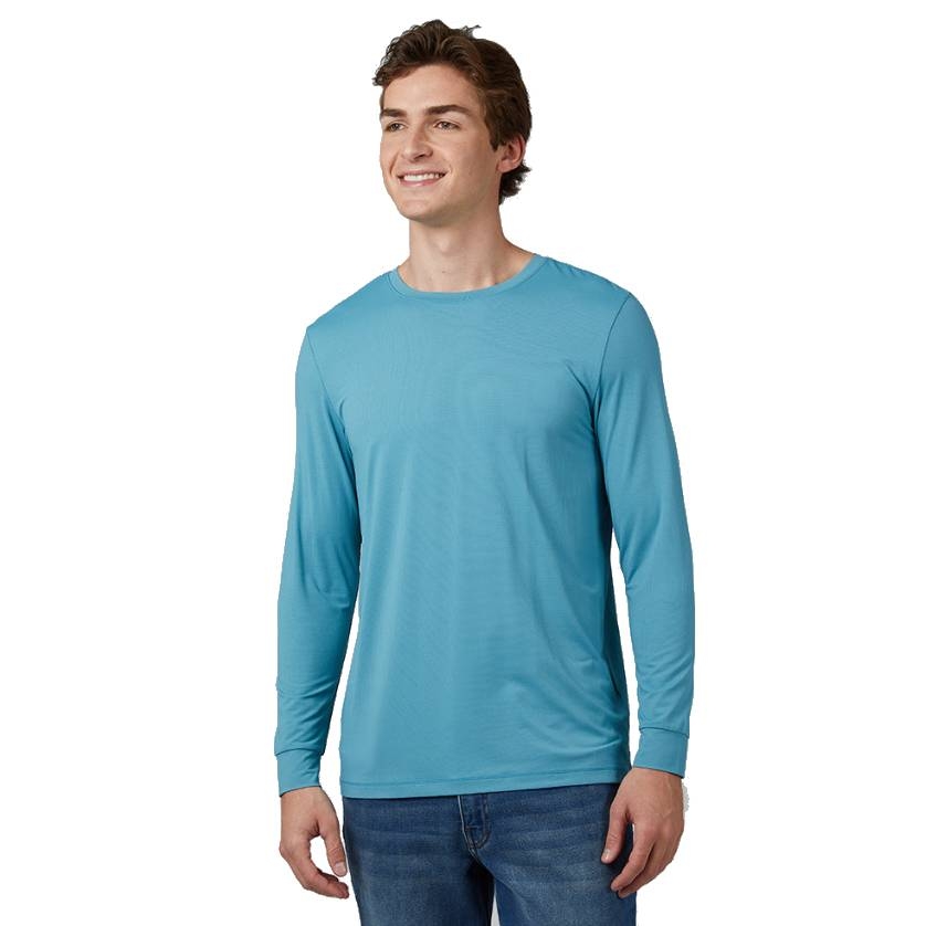 A man is wearing a light blue long-sleeve shirt made from breathable, moisture-wicking mesh fabric. The shirt has a simple design and pairs with jeans for a casual look.
