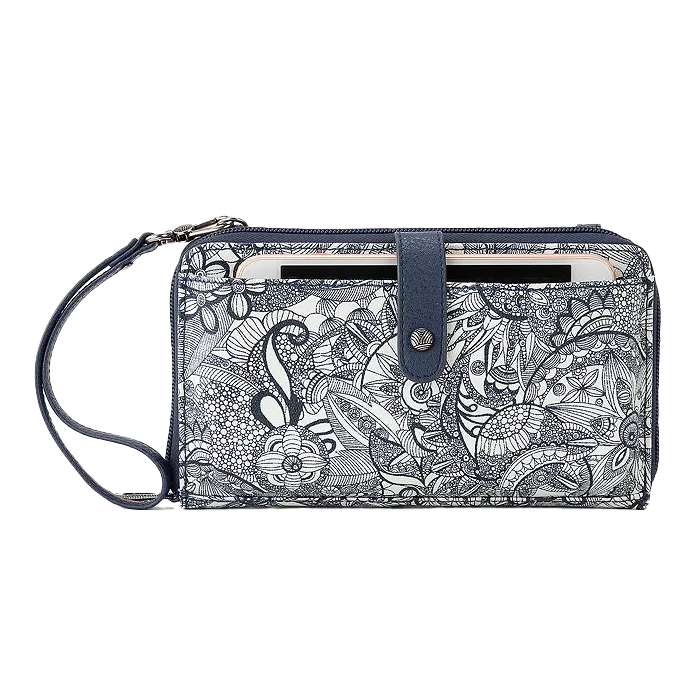 Sakroots Crossbody Wallet features a detailed black and white floral pattern with a detachable strap. It includes a snap button closure and a front pocket with a slot for cards or a phone.