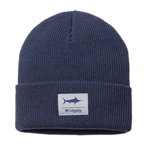 A navy blue ribbed beanie featuring a patch with a shark silhouette and \“Columbia\“ logo.