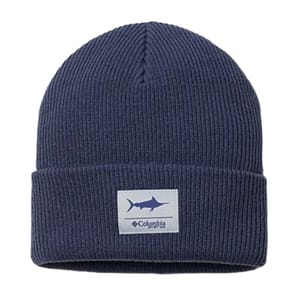 A navy blue ribbed beanie featuring a patch with a shark silhouette and \“Columbia\“ logo.