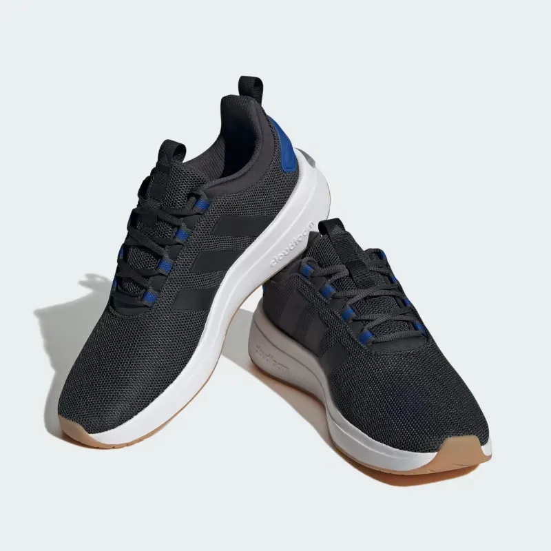 A pair of Adidas running shoes with dark uppers, blue accents, and white soles featuring Cloudfoam cushioning.