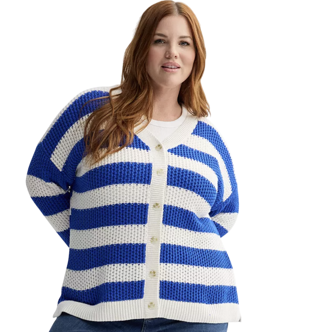 A woman is wearing a blue and white striped cardigan with a waffle-knit texture, paired with blue jeans. The cardigan has a button-up front and a white trim.
