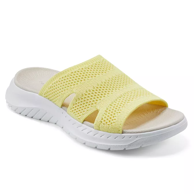 Yellow mesh slip-on sandal with a white contoured sole and open-toe design.