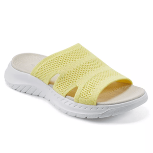 Yellow mesh slip-on sandal with a white contoured sole and open-toe design.