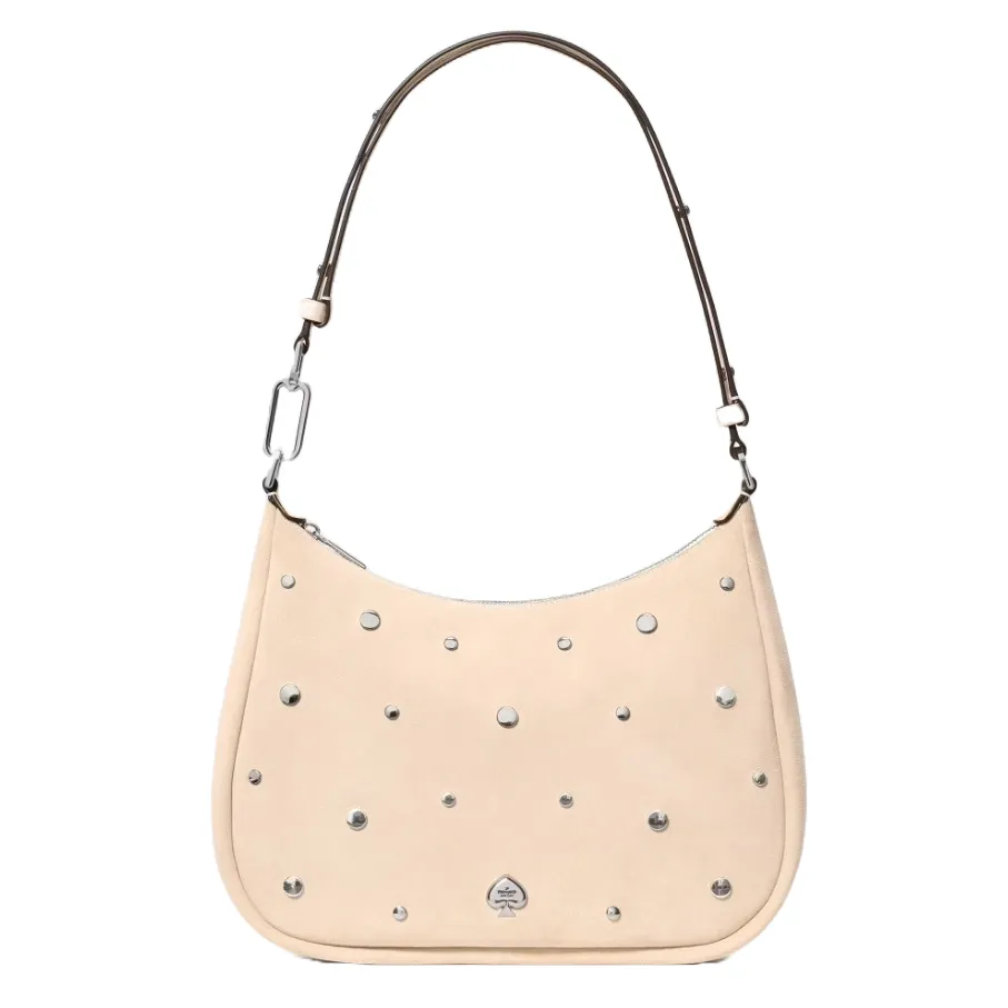 A beige shoulder bag with silver studs and a detachable strap. Features include a rounded silhouette and a discreet logo at the base.