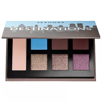 This Sephora Destinations eyeshadow palette contains eight colors ranging from matte sky blue to shimmering purple and neutrals. The case features a city skyline silhouette.