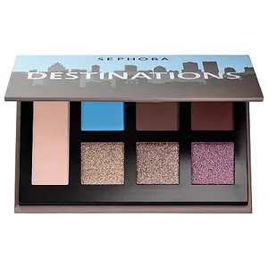 This Sephora Destinations eyeshadow palette contains eight colors ranging from matte sky blue to shimmering purple and neutrals. The case features a city skyline silhouette.