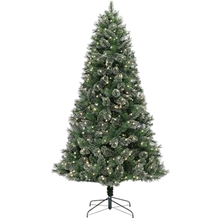 A pre-lit artificial Christmas tree with a metal stand, featuring green branches dusted with snow and integrated warm white lights.