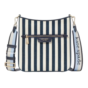 Kate Spade large messenger crossbody features blue and white vertical stripes, a front zip pocket, and an adjustable strap with the brand logo.