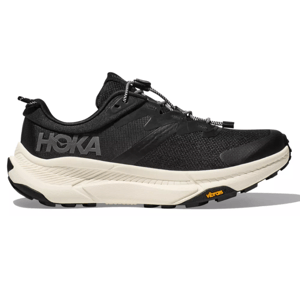 Hoka Men's Transport Shoes feature a low-cut design with a black mesh upper, white cushioned midsole, and Vibram outsole for traction. The shoe has the Hoka logo on the side and a toggle lace system for easy adjustment.