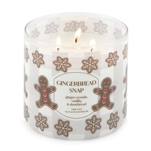 Gingerbread Snap scented candle with three wicks, featuring ginger crystals, vanilla, and shortbread notes. Decorated with gingerbread and snowflake designs.