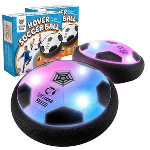 Two hover soccer balls with LED lights have a foam bumper to protect furniture. They come in packaging labeled \“Let Loose Moose,\“ featuring a multicolored light display suitable for indoor play.