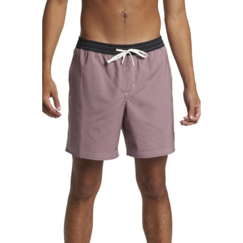 Quicksilver Straight Leg Swim Trunks feature a mauve color with a contrasting black waistband and a white drawstring. The design is simple with a mid-thigh length, suitable for casual swimming.
