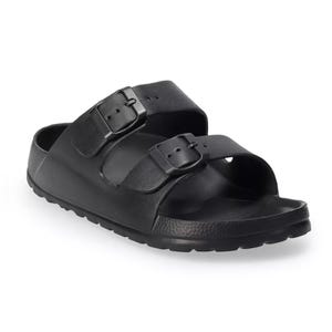 A black sandal with double adjustable straps and buckles, featuring a contoured footbed and textured sole for comfort.