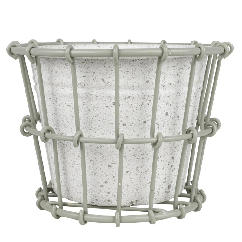 A speckled white planter enclosed in a gray wire frame, offering a simple and modern design.
