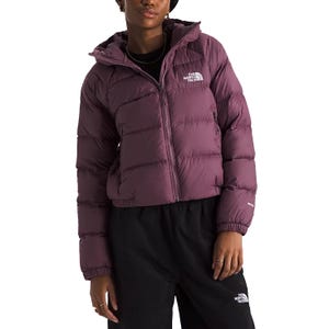 The North Face Hydrenalite Down Jacket features a plum color, quilted design with logo branding on the chest and sleeve, a front zipper, and two side pockets. It offers a puffy, insulated fit suitable for cold weather.