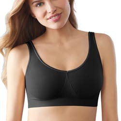 A woman is wearing a black Bali One Smooth U Bralette. The bralette features wide straps and a smooth, seamless design with ribbed detailing at the center.
