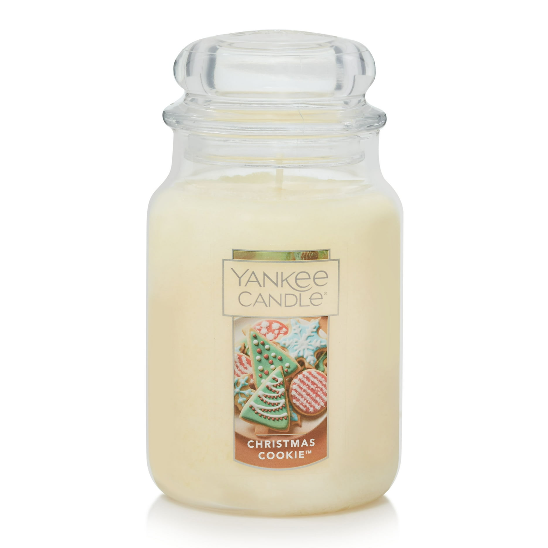 Large glass jar candle from Yankee Candle with a \“Christmas Cookie\“ scent features a creamy white wax. The label displays decorated Christmas cookies.