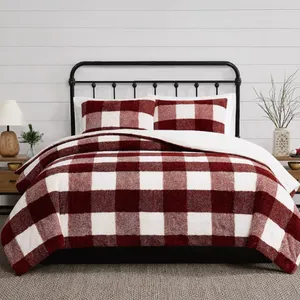 Red and white checkered bedding set on a bed with a black metal frame, accompanied by wooden bedside tables and simple decor.