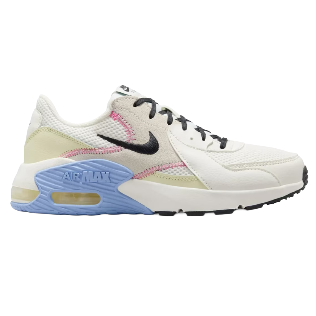 Nike Air Max sneaker in white, with black laces, black Swoosh logo, pastel pink and green accents, and a light blue sole featuring the Air Max cushioning unit.