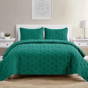 Teal King Quilt Set includes a quilt and two pillow shams, featuring a textured geometric pattern. The set is displayed in a minimalist bedroom with a white bed frame and side tables.