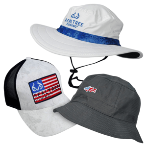 3-pack of Realtree Fishing hats includes a white boonie hat with a blue band, a white and black mesh-back cap with an American flag design, and a gray bucket hat with a small fish logo.