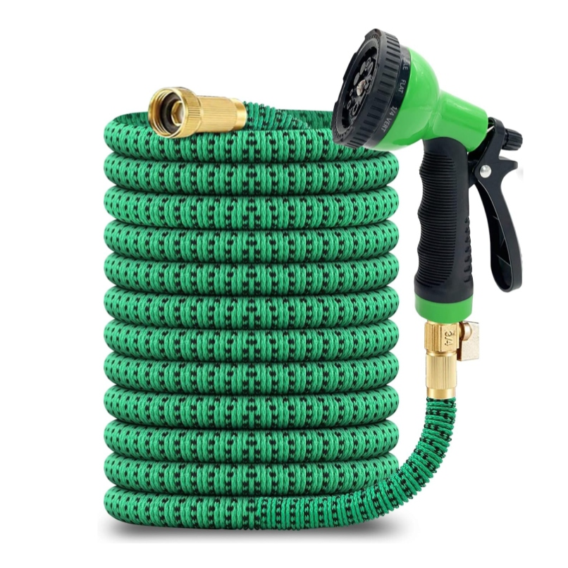 Expandable garden hose with a green fabric exterior and brass connectors, featuring an adjustable spray nozzle with a black grip.