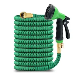 Expandable garden hose with a green fabric exterior and brass connectors, featuring an adjustable spray nozzle with a black grip.