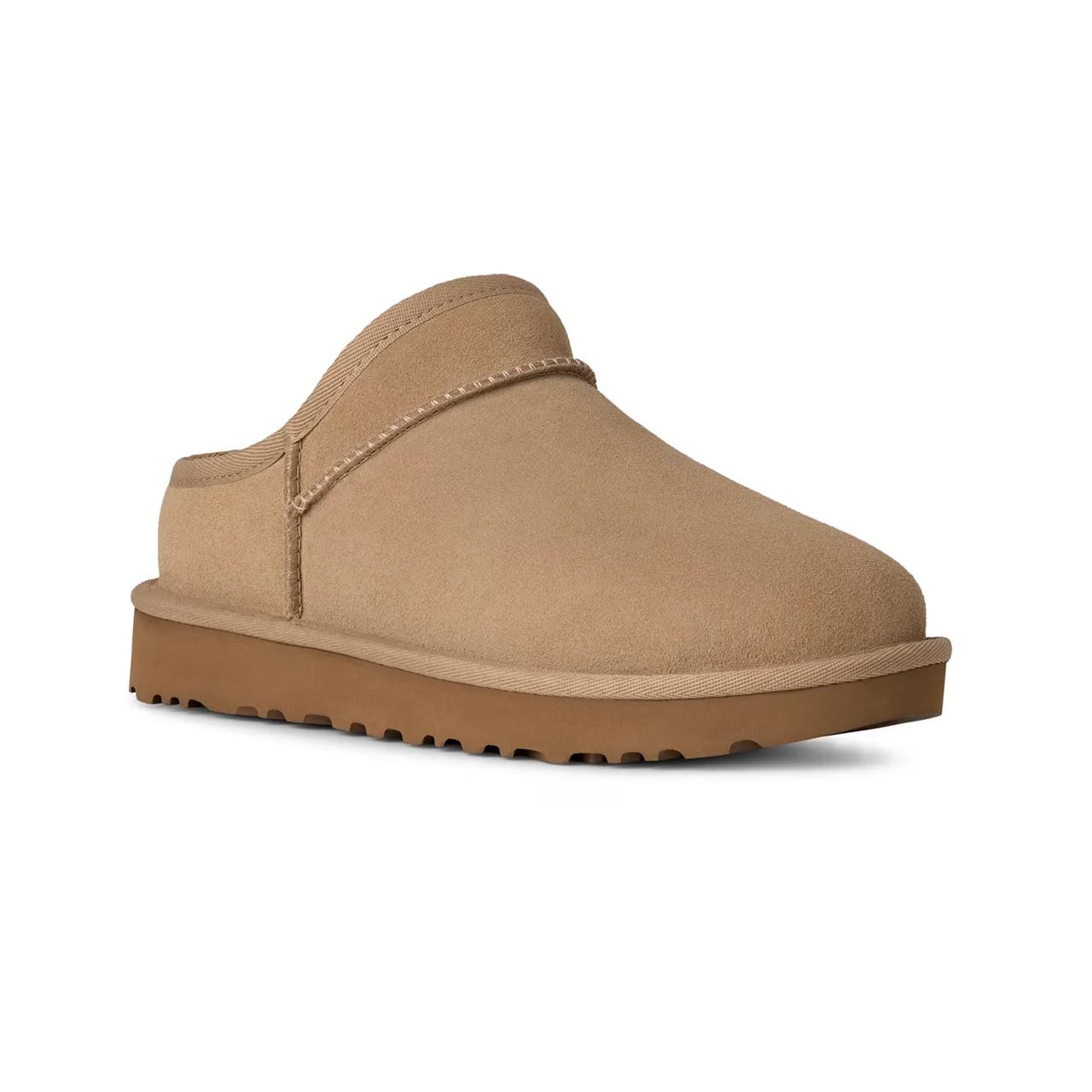 A tan suede clog with a rounded toe and a thick rubber sole designed for comfort and warmth.