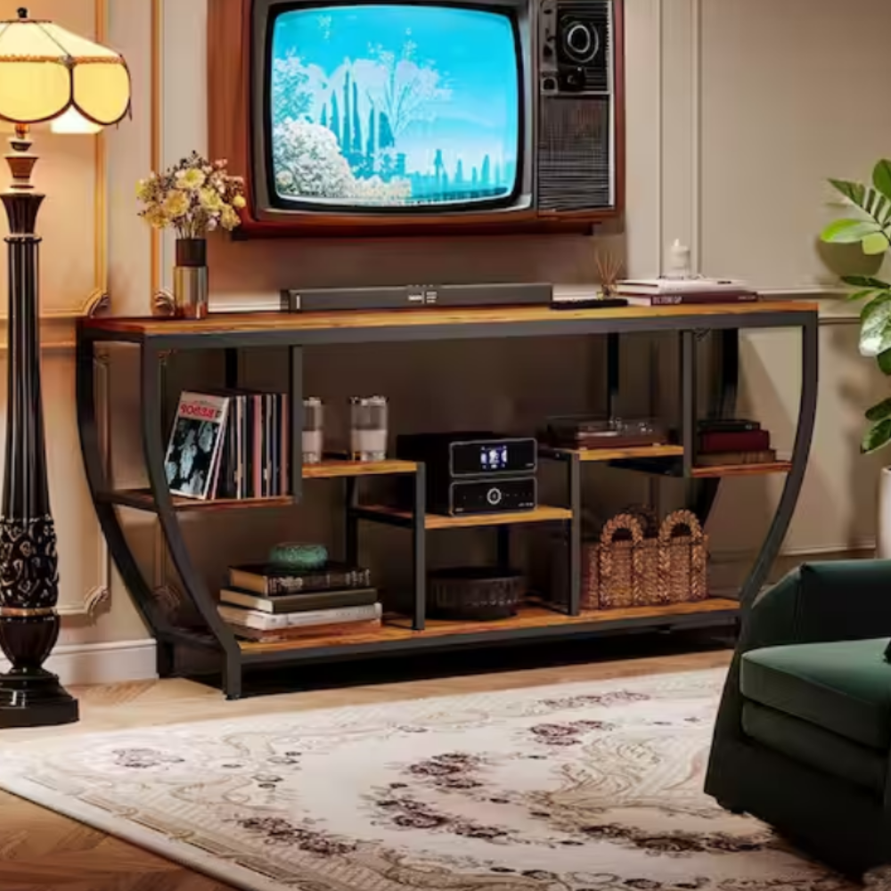 A vintage television set is mounted above a console table with shelves, holding vinyl records, a radio, and decorative items, flanked by a floor lamp and a patterned rug in a stylish living room setup.