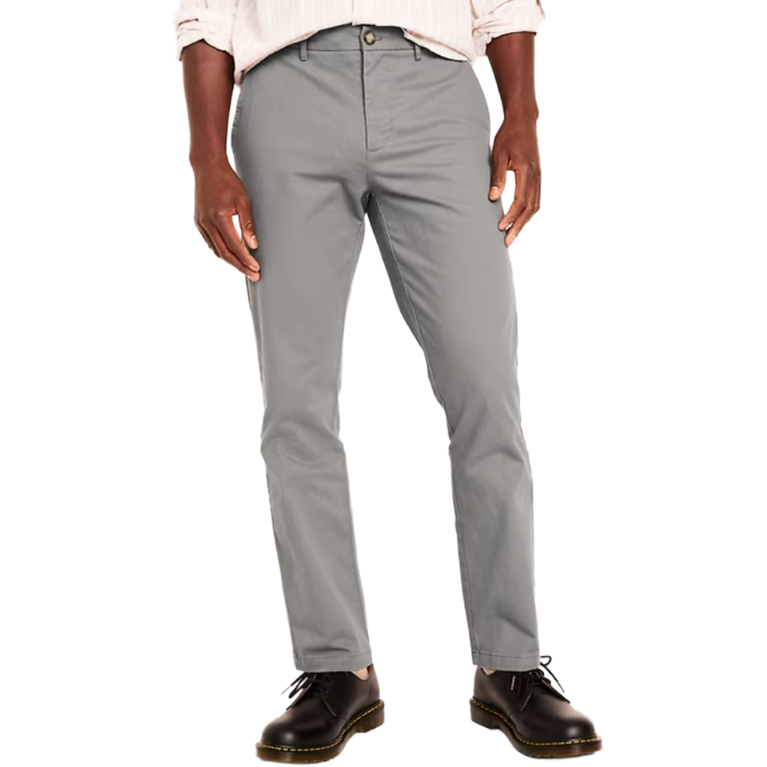 Gray pants worn with a light-colored shirt and black shoes.