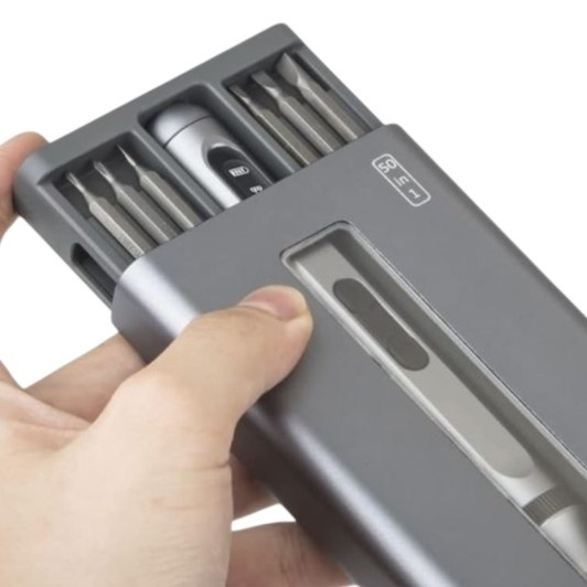 A compact screwdriver set featuring multiple precision bits organized in a sleek, portable case, ideal for electronics or small repairs.