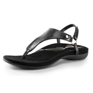 A black thong-style sandal with a textured strap and adjustable ankle buckle, featuring a contoured footbed for comfort.