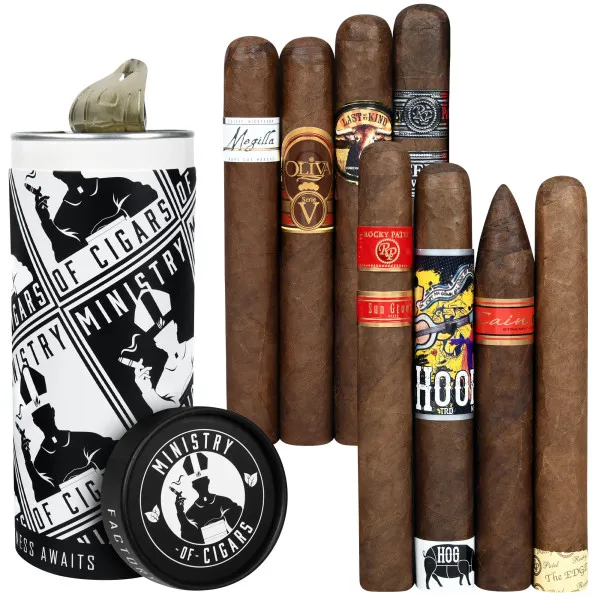 A selection of cigars is displayed alongside a cylindrical container labeled \“Ministry of Cigars,\“ featuring various cigar bands with different designs and colors.