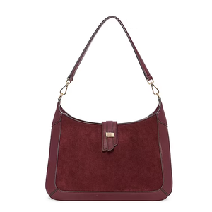 A maroon shoulder bag with a suede texture and leather trim, featuring a detachable strap and gold-tone hardware.