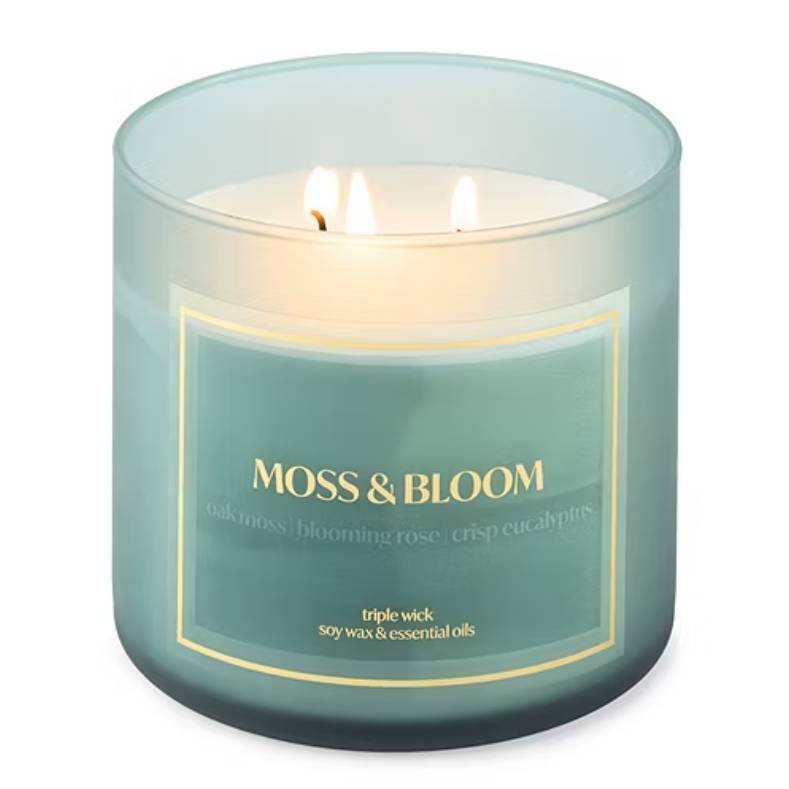 Moss & Bloom candle with triple wick, featuring a blend of oak moss, blooming rose, and crisp eucalyptus scents. Made with soy wax and essential oils.