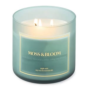 Moss & Bloom candle with triple wick, featuring a blend of oak moss, blooming rose, and crisp eucalyptus scents. Made with soy wax and essential oils.