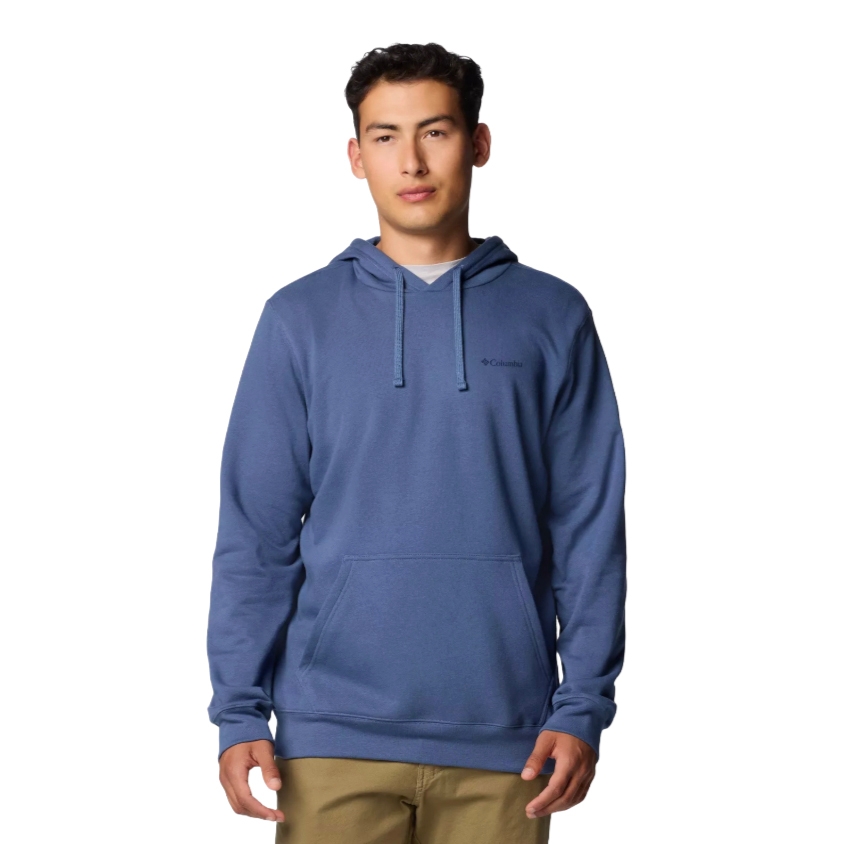A person is wearing a blue Columbia hoodie with a front pocket and drawstrings, paired with tan pants.