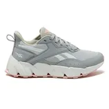 A gray and white Reebok sneaker with a chunky sole and pink accents, featuring the Reebok logo on the side and a pull tab at the heel.