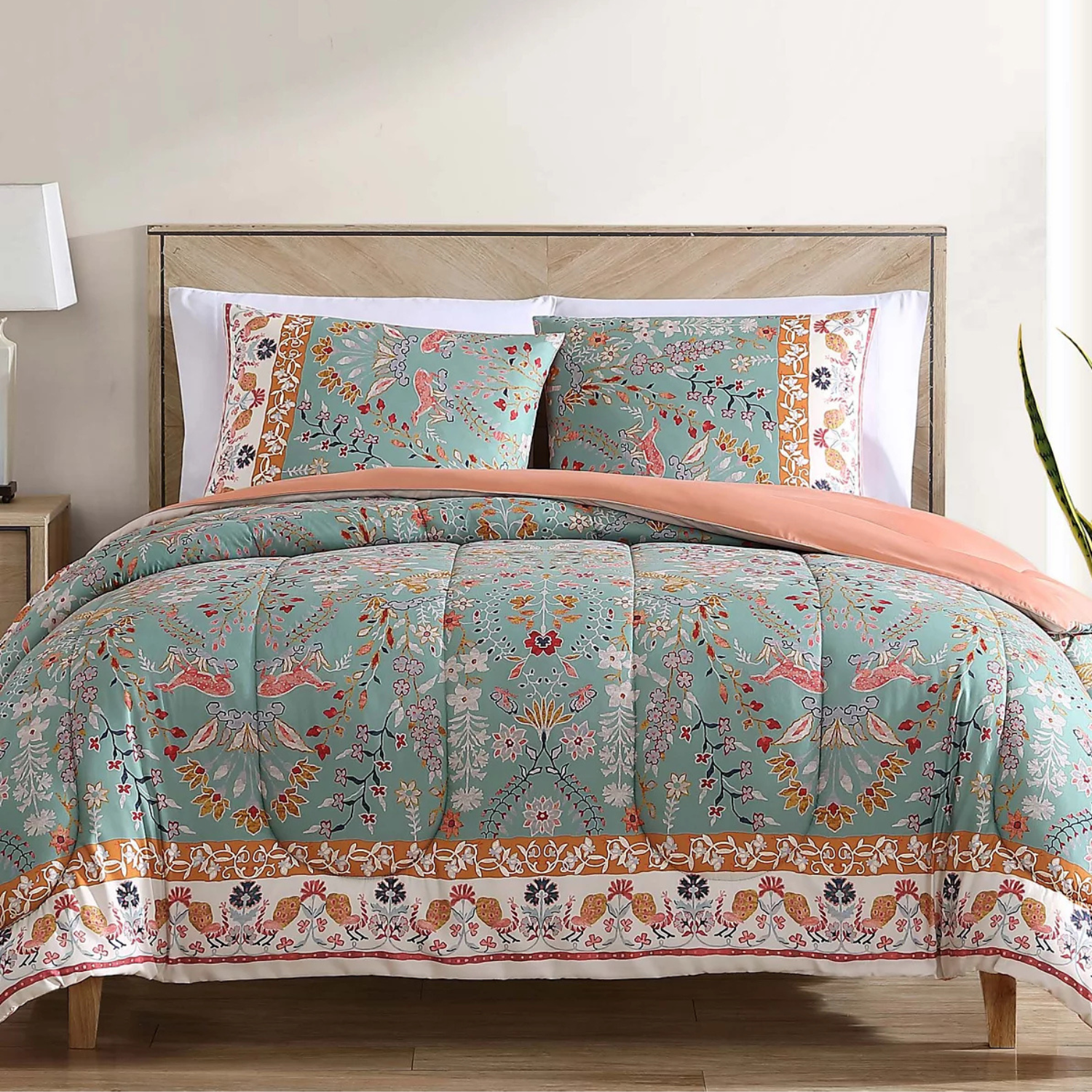 A 3-piece queen comforter set featuring a floral and bird pattern on a teal background with orange and white borders, including a comforter and two matching pillow shams.