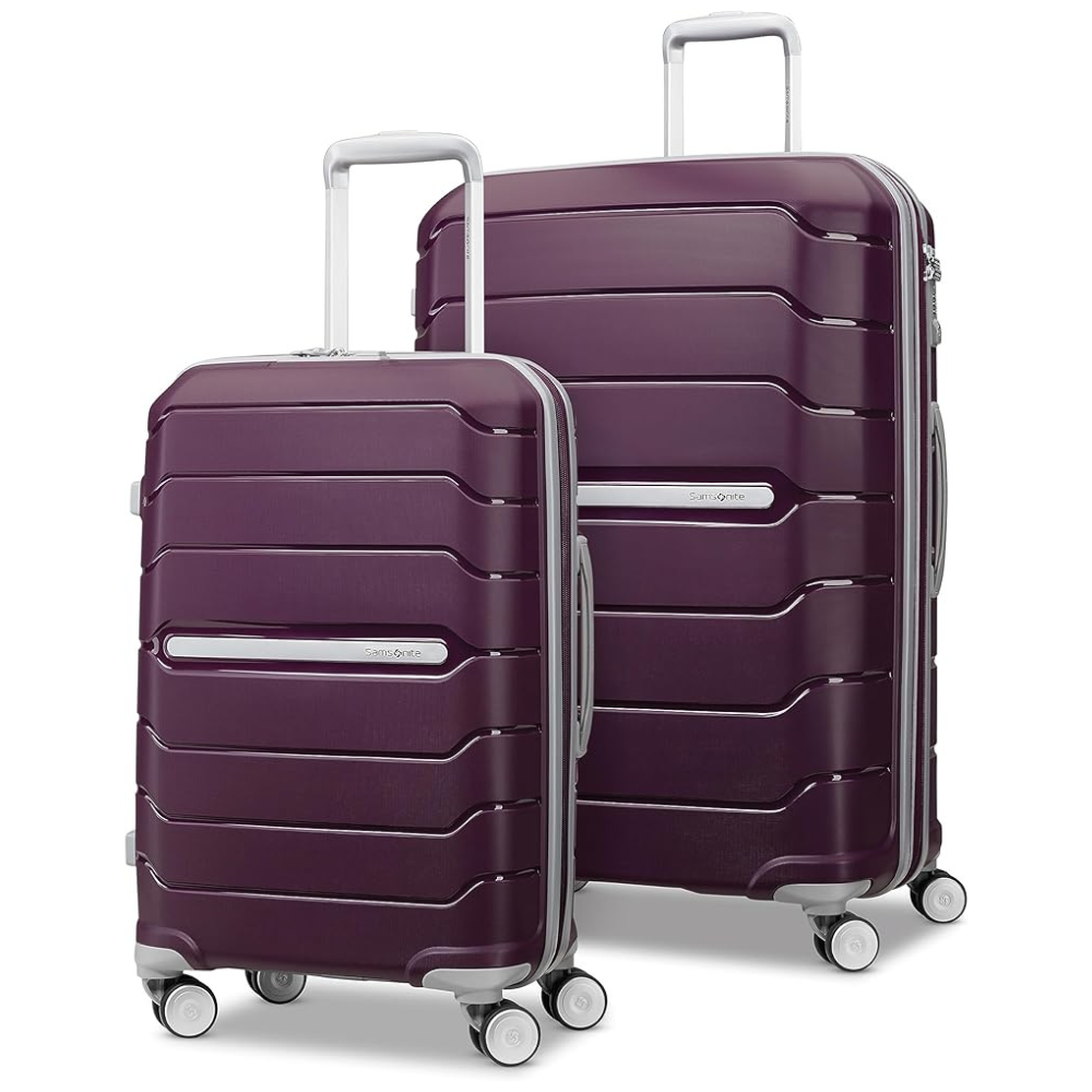 Two purple, hard-shell suitcases with silver handles and four wheels, designed for easy mobility and likely part of a luggage set.