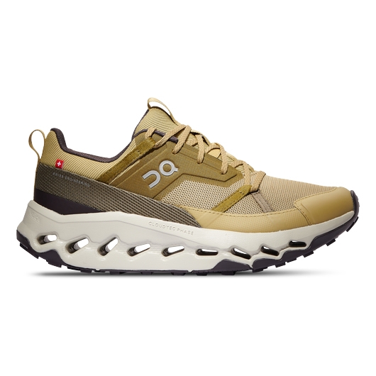On Cloudhorizon Shoes are tan athletic sneakers featuring a mesh upper, lace-up design, and distinctive cloud-like sole technology for cushioning. Suitable for various terrains, they combine comfort and style with a lightweight, breathable build.
