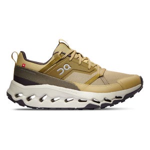 On Cloudhorizon Shoes are tan athletic sneakers featuring a mesh upper, lace-up design, and distinctive cloud-like sole technology for cushioning. Suitable for various terrains, they combine comfort and style with a lightweight, breathable build.