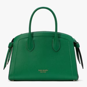 Green Kate Spade handbag with short handles and a zippered top closure.