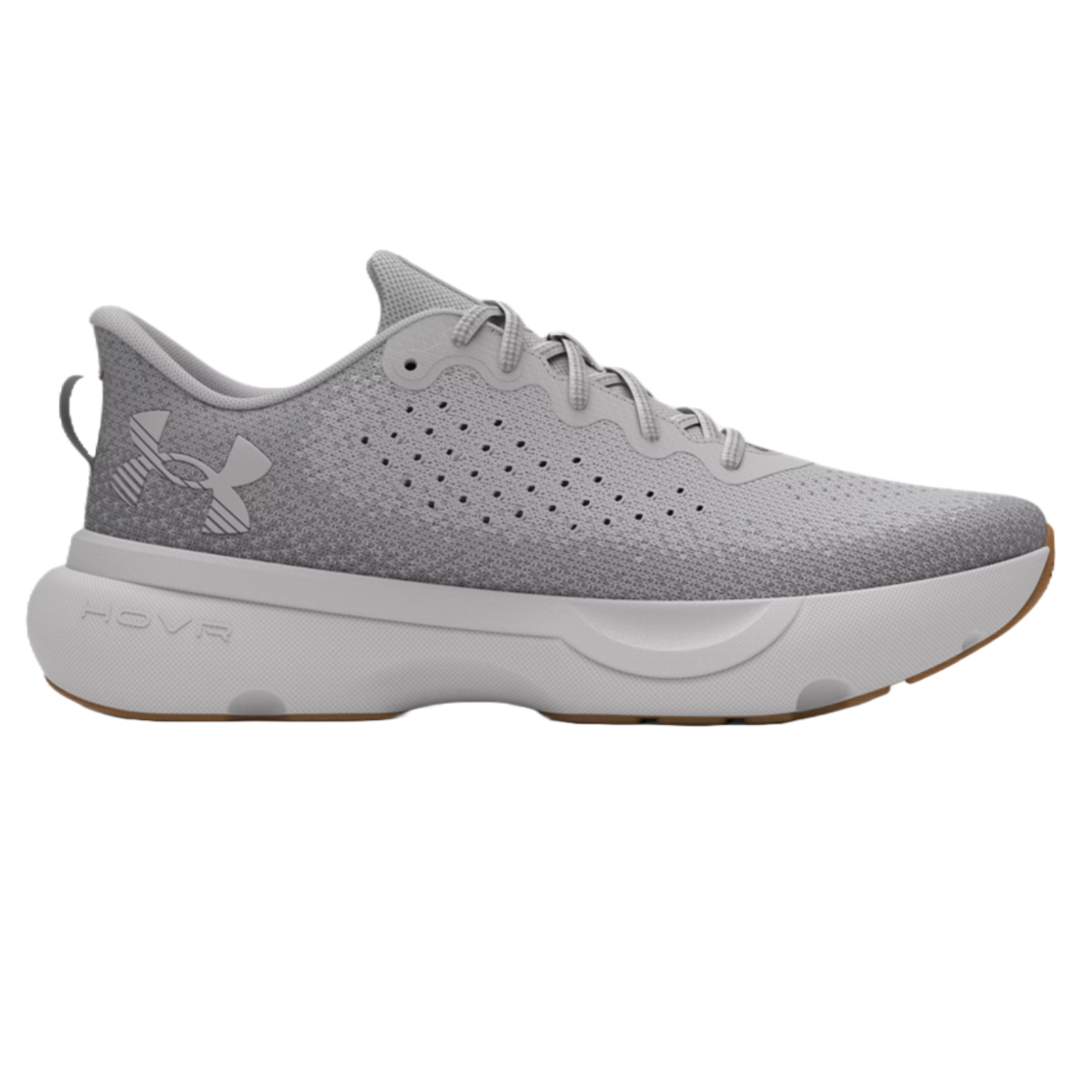Light gray Under Armour athletic shoe with a perforated design, lace-up closure, and a thick white sole featuring the HOVR cushioning technology.