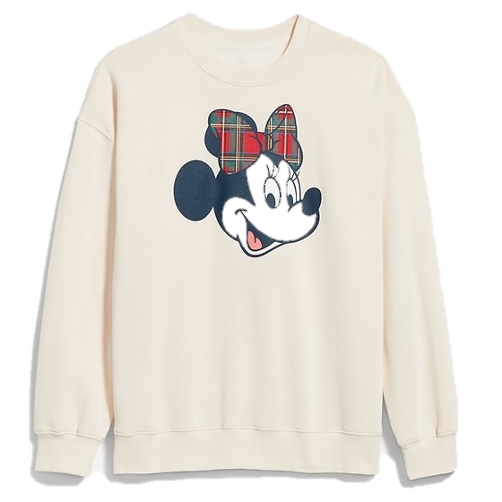A cream-colored sweatshirt featuring a character with a plaid bow.